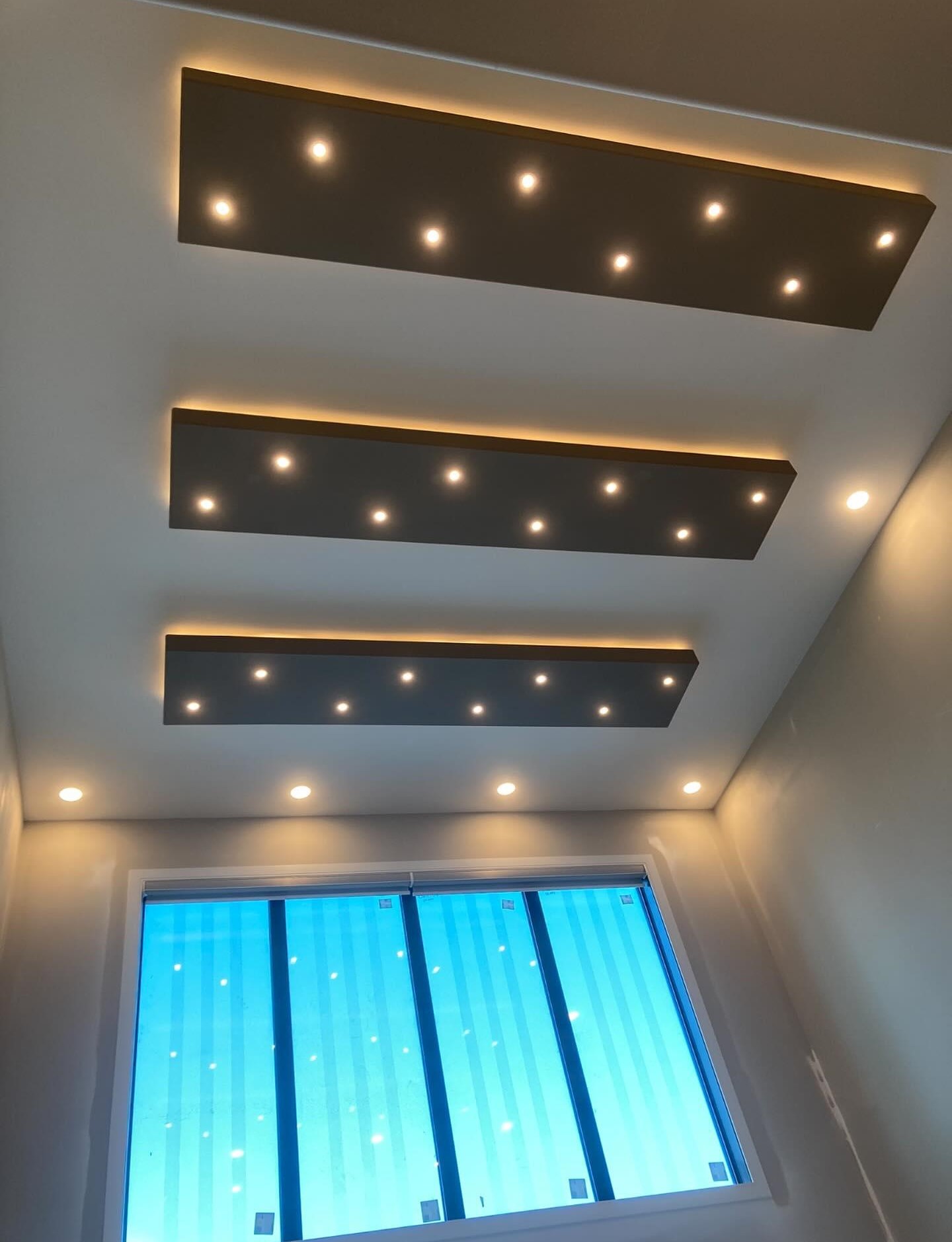 Custom recessed and cove lighting installed by Lazo Electric in a modern home
